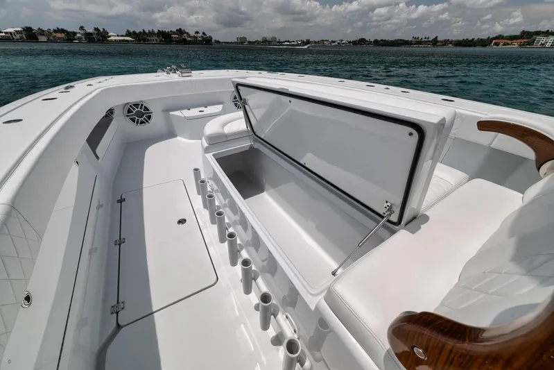 Sycorax Yacht Photos Pics 2024 Freeman 43 CC boat interior with open storage, white seating, and ocean view.