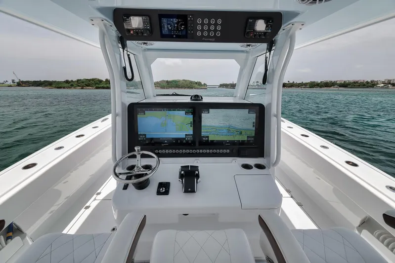 Sycorax Yacht Photos Pics 2024 Freeman 43 CC boat cockpit with dual navigation screens and steering wheel.