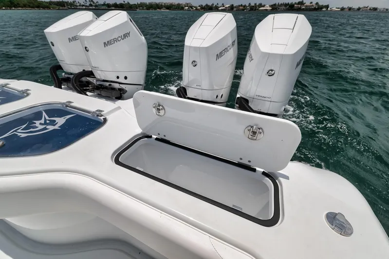 Sycorax Yacht Photos Pics 2024 Freeman 43 CC boat with Mercury engines and open storage compartment on the water.