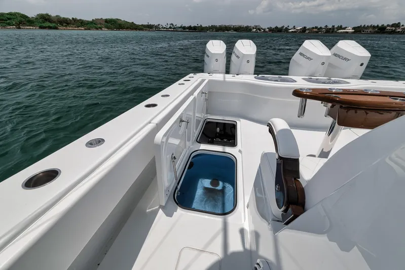 Sycorax Yacht Photos Pics 2024 Freeman 43 CC boat deck with seating and storage, featuring multiple outboard engines.