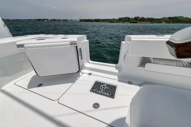 Sycorax Yacht Photos Pics 2024 Freeman 43 CC boat deck with storage compartments, overlooking calm waters.