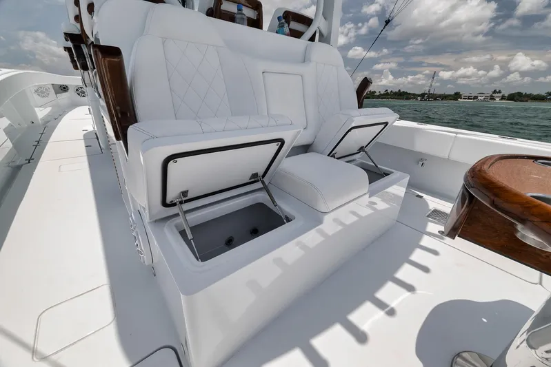 Sycorax Yacht Photos Pics 2024 Freeman 43 CC boat with white cushioned seating and storage compartments.