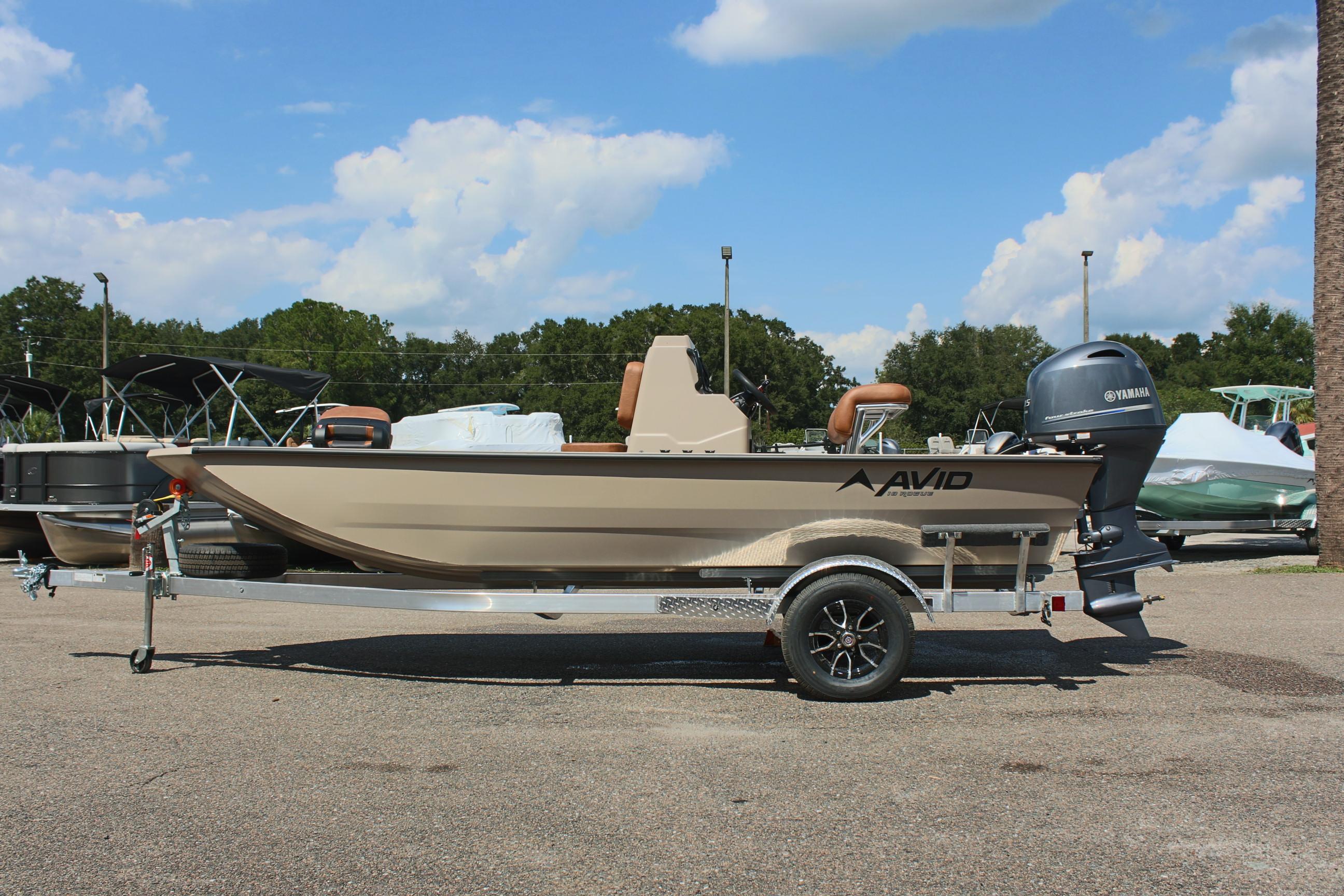 2025 Avid 18 Rogue CC boat on trailer, parked outdoors under blue sky.