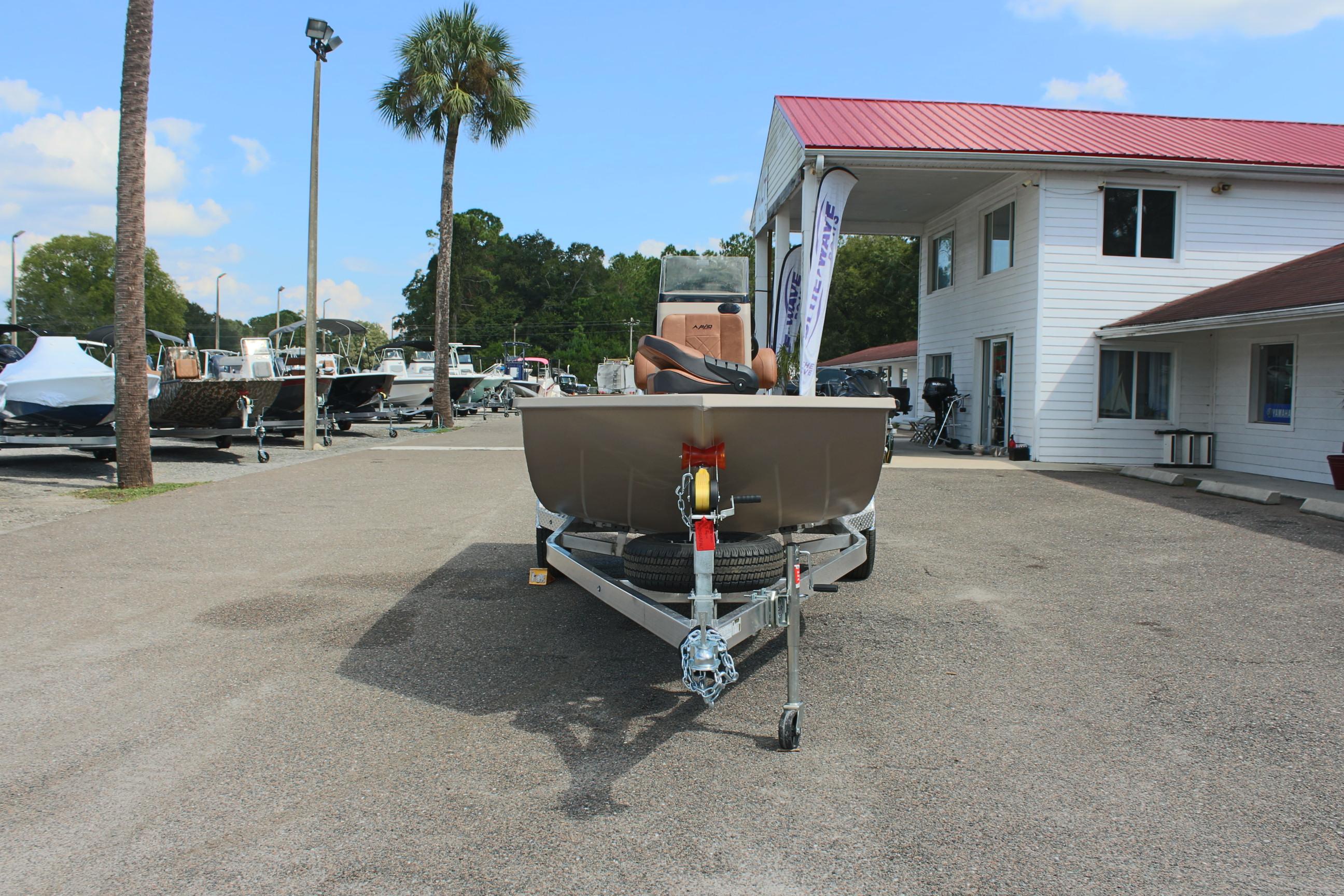 2025 Avid 18 Rogue CC boat on trailer at dealership.