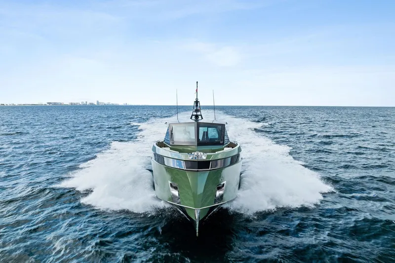 Another World Yacht Photos Pics 2025 Wally Wallytender 100 yacht cruising on open sea under clear blue sky.