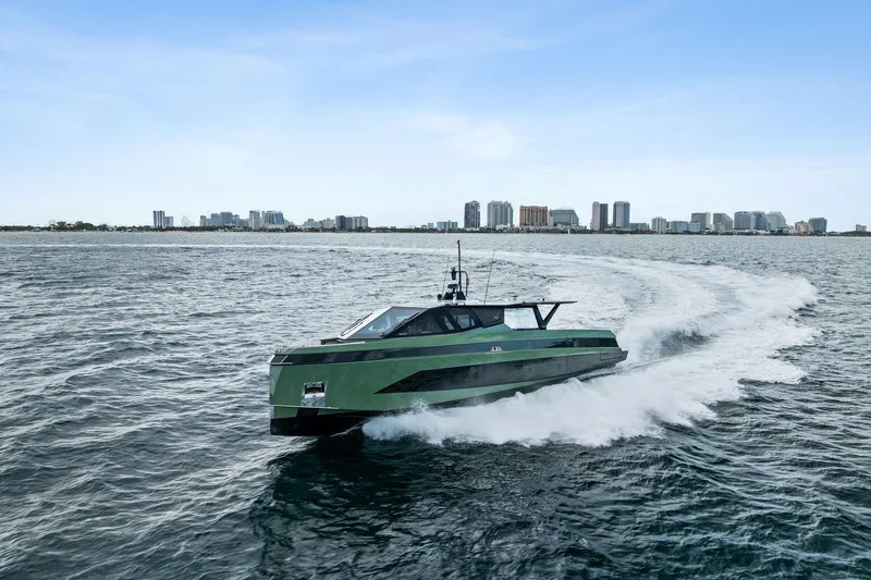 Another World Yacht Photos Pics 2025 Wally Wallytender 100 yacht cruising near city skyline on open water.