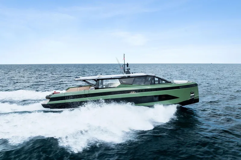 Another World Yacht Photos Pics 2025 Wally Wallytender 100 yacht cruising on open sea under clear sky.