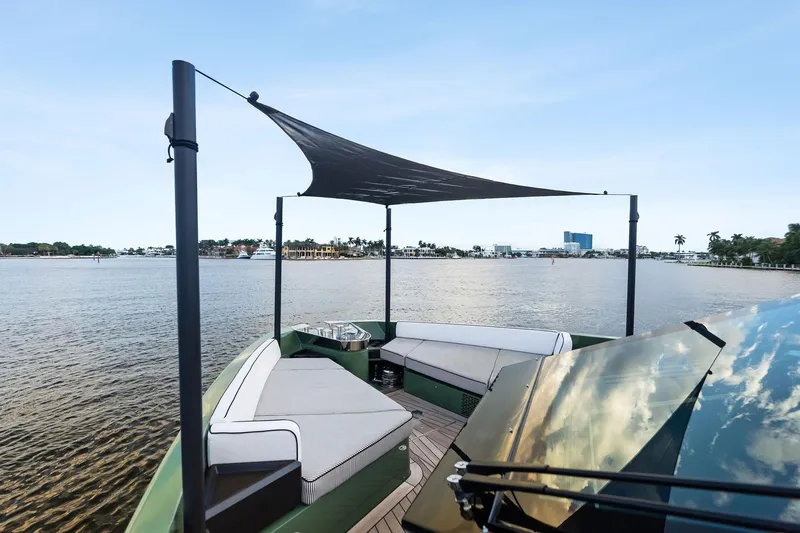 Another World Yacht Photos Pics 2025 Wally Wallytender 100 yacht with shaded seating area on calm water.