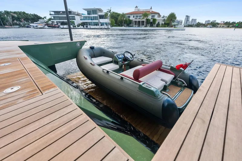 Another World Yacht Photos Pics 2025 Wally Wallytender 100 docked with inflatable boat on water.