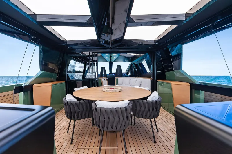 Another World Yacht Photos Pics Luxurious 2025 Wally Wallytender 100 yacht interior with elegant dining area and ocean view.