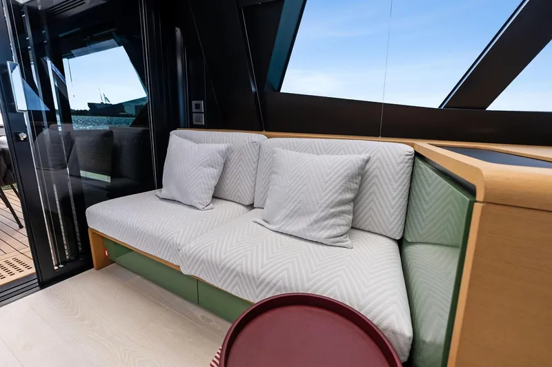 Another World Yacht Photos Pics Luxurious interior of 2025 Wally Wallytender 100 yacht with elegant seating.
