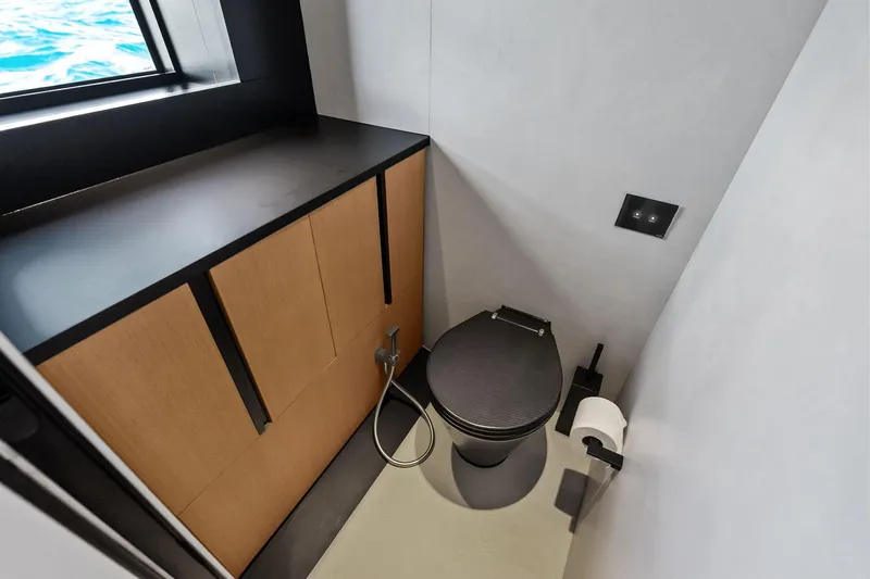 Another World Yacht Photos Pics Modern bathroom in 2025 Wally Wallytender 100 yacht with sleek design and ocean view.