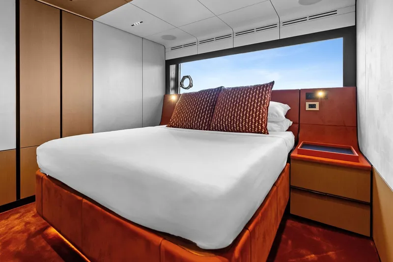 Another World Yacht Photos Pics Luxurious bedroom interior of 2025 Wally Wallytender 100 yacht with modern design.