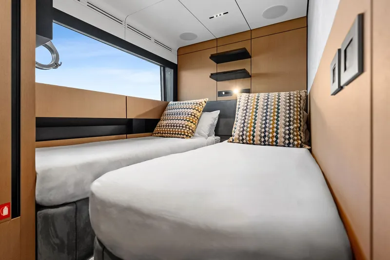Another World Yacht Photos Pics Interior of 2025 Wally Wallytender 100 yacht with twin beds and modern decor.