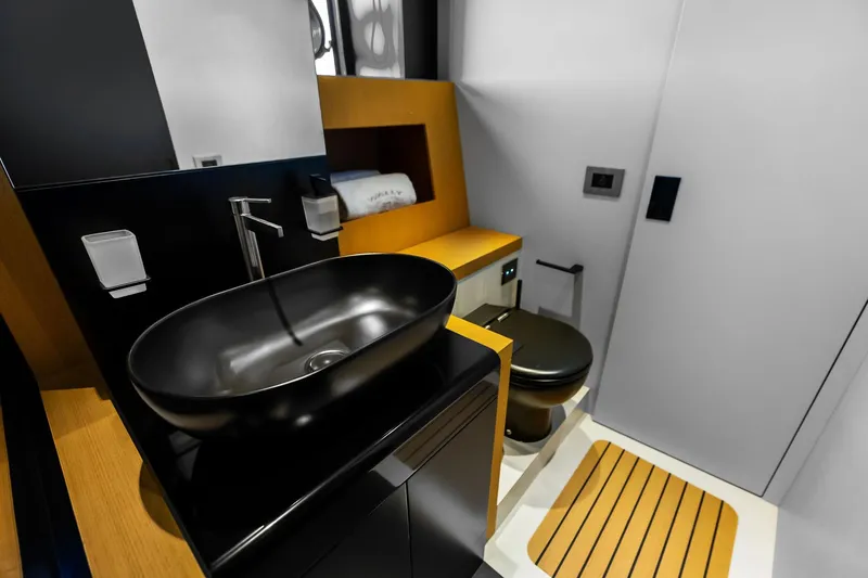 Another World Yacht Photos Pics Luxurious bathroom interior of 2025 Wally Wallytender 100 yacht with modern fixtures.