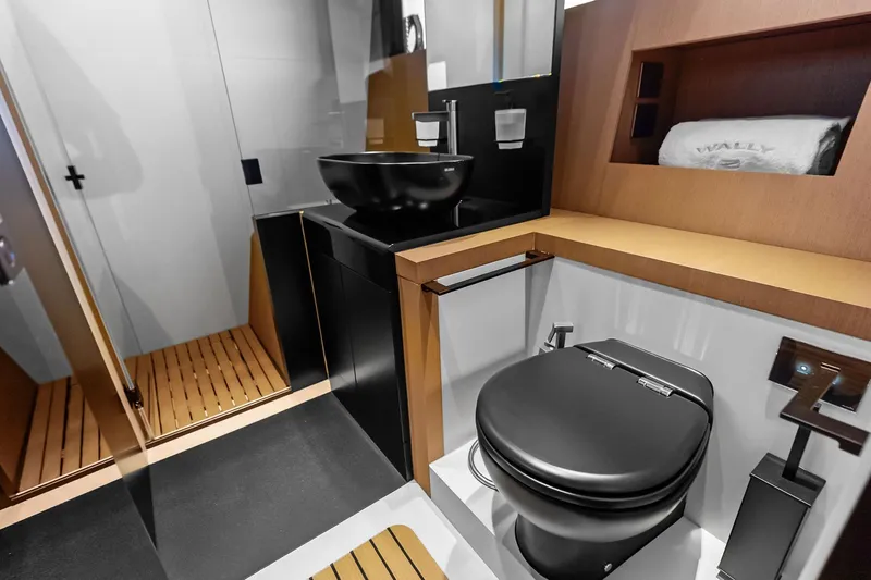 Another World Yacht Photos Pics Luxurious bathroom interior of 2025 Wally Wallytender 100 yacht with modern fixtures.