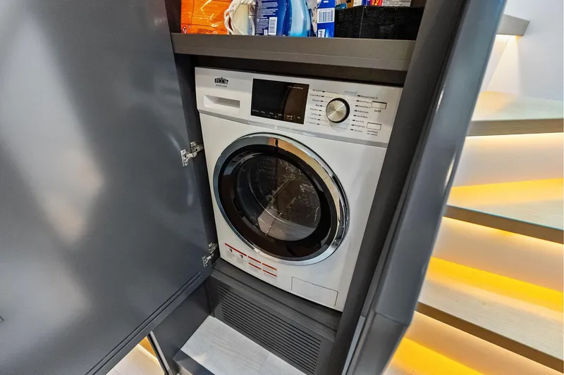 Another World Yacht Photos Pics Compact washing machine in a cabinet on the 2025 Wally Wallytender 100 yacht.