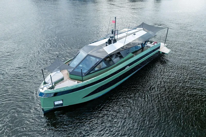 Another World Yacht Photos Pics 2025 Wally Wallytender 100 yacht on calm water, featuring sleek modern design.