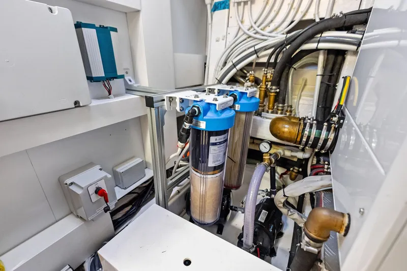 Another World Yacht Photos Pics Engine room of 2025 Wally Wallytender 100 with filtration system and wiring.