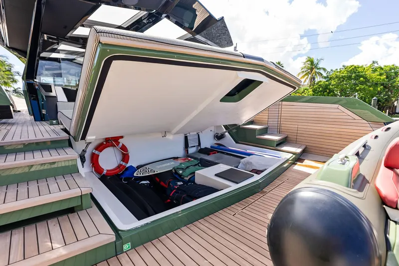 Another World Yacht Photos Pics 2025 Wally Wallytender 100 yacht with open storage compartment, showcasing deck and equipment.