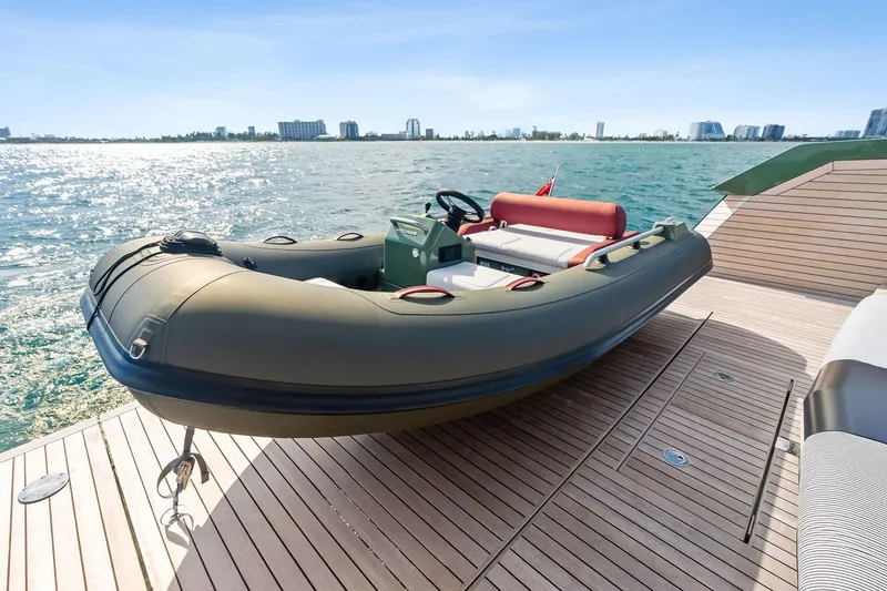 Another World Yacht Photos Pics Luxury Wallytender 100 yacht, 2025 model, docked with inflatable boat on deck.