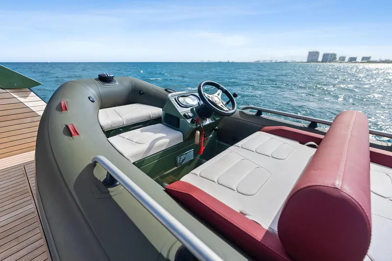 Another World Yacht Photos Pics 2025 Wally Wallytender 100 boat interior with ocean view, featuring sleek seating and steering wheel.