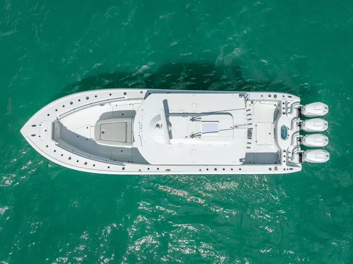  Yacht Photos Pics Aerial view of 2024 Yellowfin 39 boat on turquoise water.
