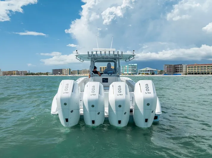  Yacht Photos Pics 2024 Yellowfin 39 boat with four powerful outboard engines on the water.