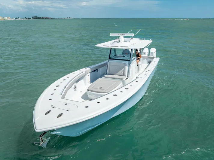  Yacht Photos Pics 2024 Yellowfin 39 boat cruising on open water under clear skies.