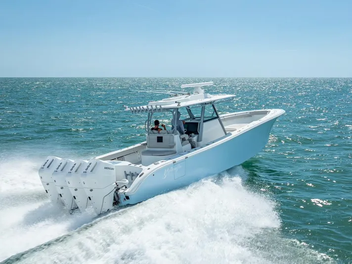  Yacht Photos Pics 2024 Yellowfin 39 boat cruising on open ocean waters.