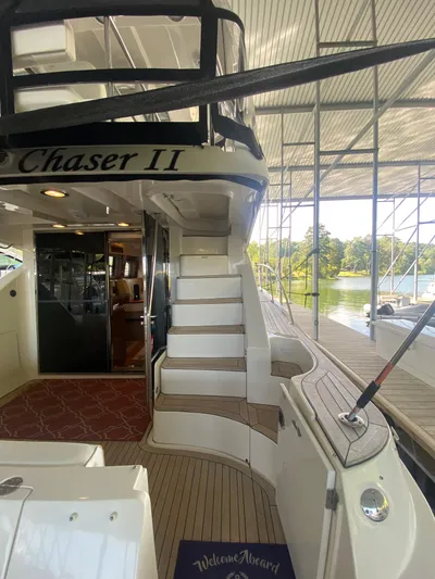 Dream Chaser Yacht Photos Pics 2008 Sea Ray 47 Sedan Bridge yacht docked, featuring elegant stairs and a welcoming interior.