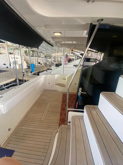 Dream Chaser Yacht Photos Pics 2008 Sea Ray 47 Sedan Bridge yacht interior with wooden deck and stairs.