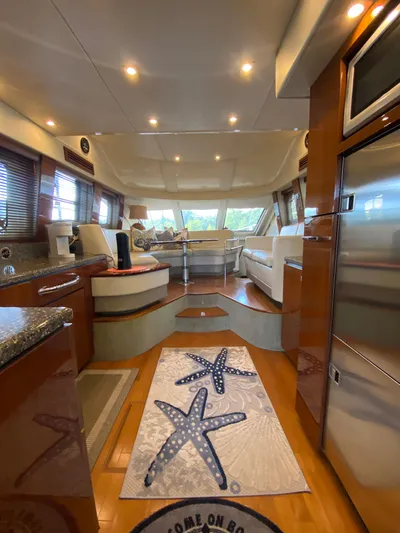 Dream Chaser Yacht Photos Pics Luxurious interior of 2008 Sea Ray 47 Sedan Bridge yacht with modern furnishings.