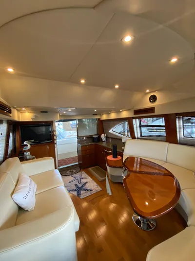 Dream Chaser Yacht Photos Pics Luxurious interior of 2008 Sea Ray 47 Sedan Bridge yacht with elegant furnishings.