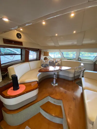 Dream Chaser Yacht Photos Pics Luxurious interior of 2008 Sea Ray 47 Sedan Bridge yacht with elegant seating and wooden flooring.