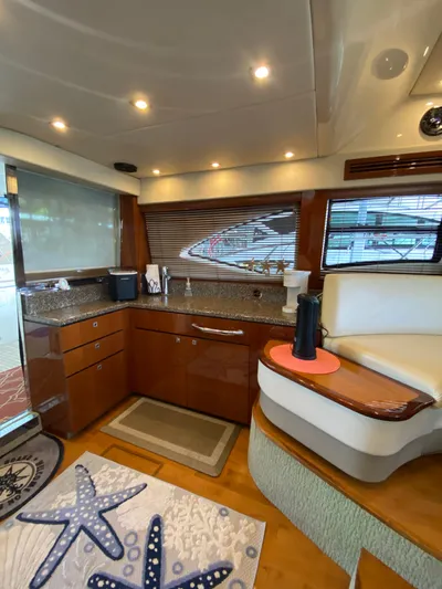 Dream Chaser Yacht Photos Pics Luxurious interior of 2008 Sea Ray 47 Sedan Bridge yacht with modern kitchen amenities.