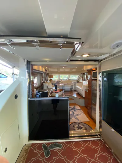 Dream Chaser Yacht Photos Pics Interior view of 2008 Sea Ray 47 Sedan Bridge yacht, featuring luxurious seating and decor.