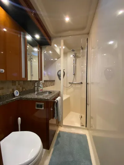 Dream Chaser Yacht Photos Pics Luxurious bathroom in 2008 Sea Ray 47 Sedan Bridge yacht with shower and modern fixtures.
