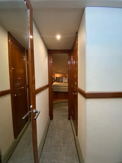 Dream Chaser Yacht Photos Pics Hallway leading to a cozy bedroom on a 2008 Sea Ray 47 Sedan Bridge yacht.