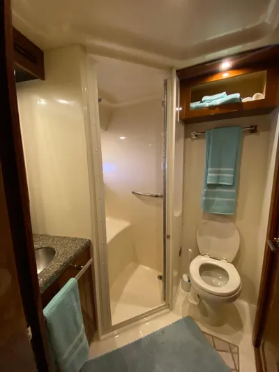 Dream Chaser Yacht Photos Pics Bathroom interior of 2008 Sea Ray 47 Sedan Bridge yacht with shower and toilet.