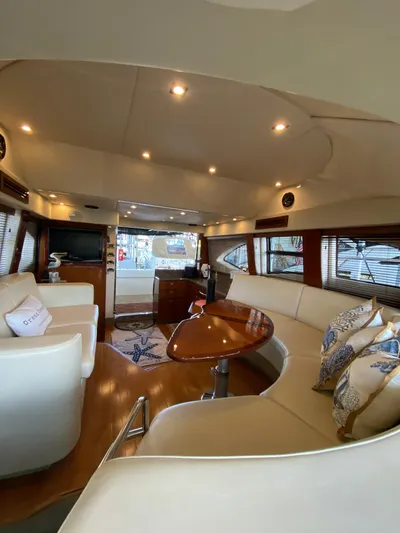 Dream Chaser Yacht Photos Pics Luxurious interior of 2008 Sea Ray 47 Sedan Bridge yacht with elegant seating and decor.