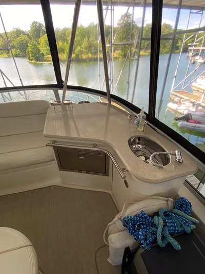 Dream Chaser Yacht Photos Pics 2008 Sea Ray 47 Sedan Bridge interior with sink, counter, and scenic water view.
