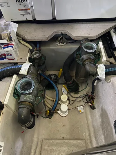 Dream Chaser Yacht Photos Pics Engine compartment of a 2008 Sea Ray 47 Sedan Bridge with visible hoses and components.