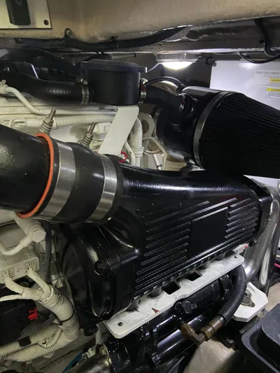 Dream Chaser Yacht Photos Pics Engine compartment of a 2008 Sea Ray 47 Sedan Bridge yacht, showcasing detailed components.