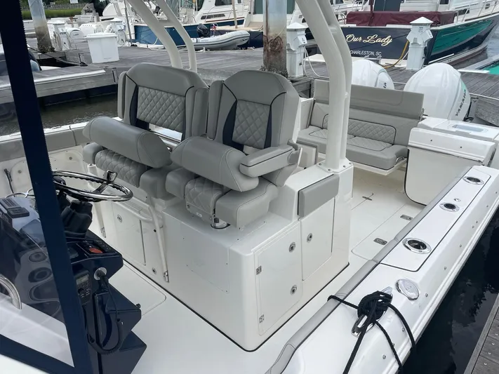  Yacht Photos Pics 2022 Pursuit S 328 Sport boat interior with dual helm seats and rear seating.