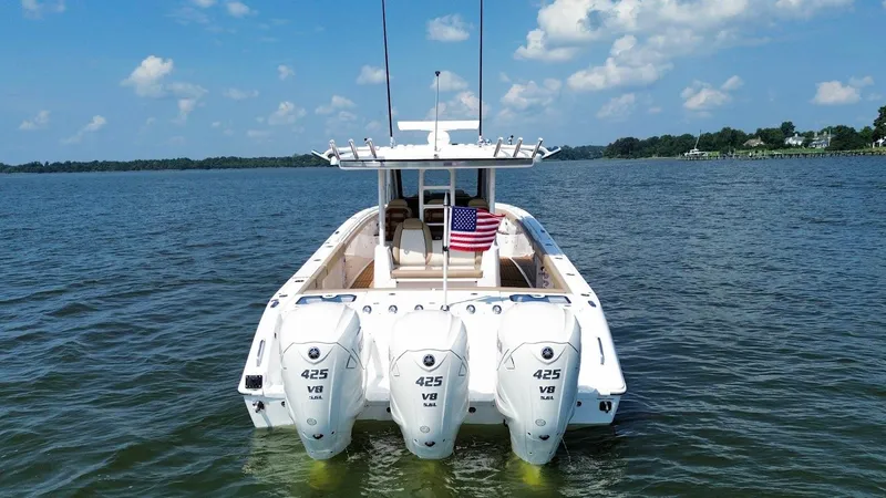  Yacht Photos Pics 2023 Everglades 395 Center Console boat with triple 425 V8 engines on open water.