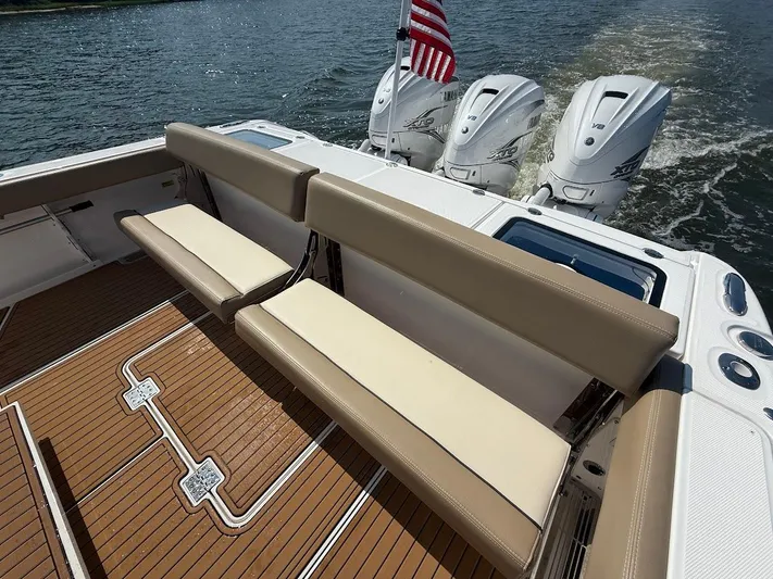  Yacht Photos Pics 2023 Everglades 395 Center Console boat with triple engines and teak deck.