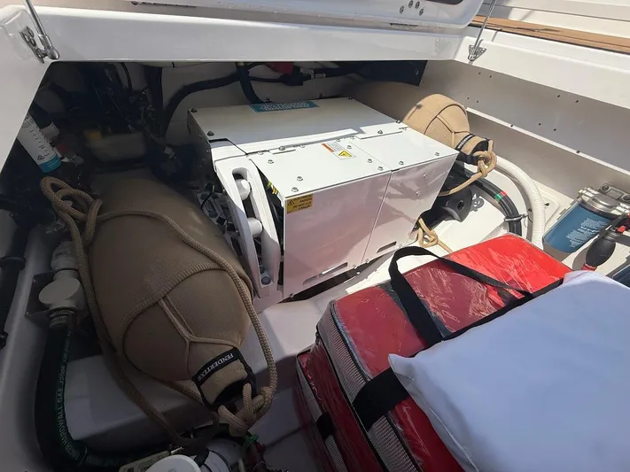 Yacht Photos Pics 2023 Everglades 395 Center Console engine compartment with equipment and storage.
