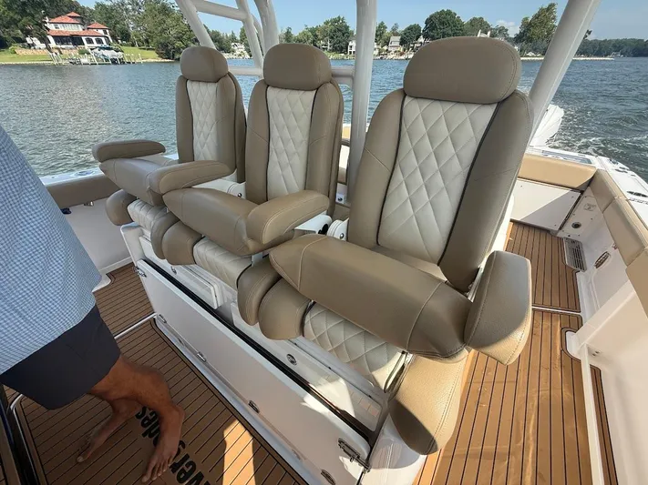  Yacht Photos Pics Luxurious seating on 2023 Everglades 395 Center Console boat, featuring elegant design and comfort.