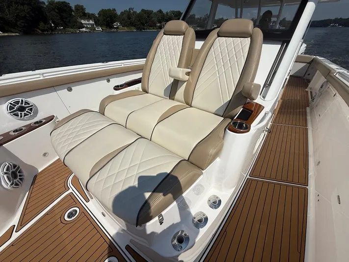  Yacht Photos Pics Luxurious seating on 2023 Everglades 395 Center Console boat, featuring elegant design and craftsmanship.
